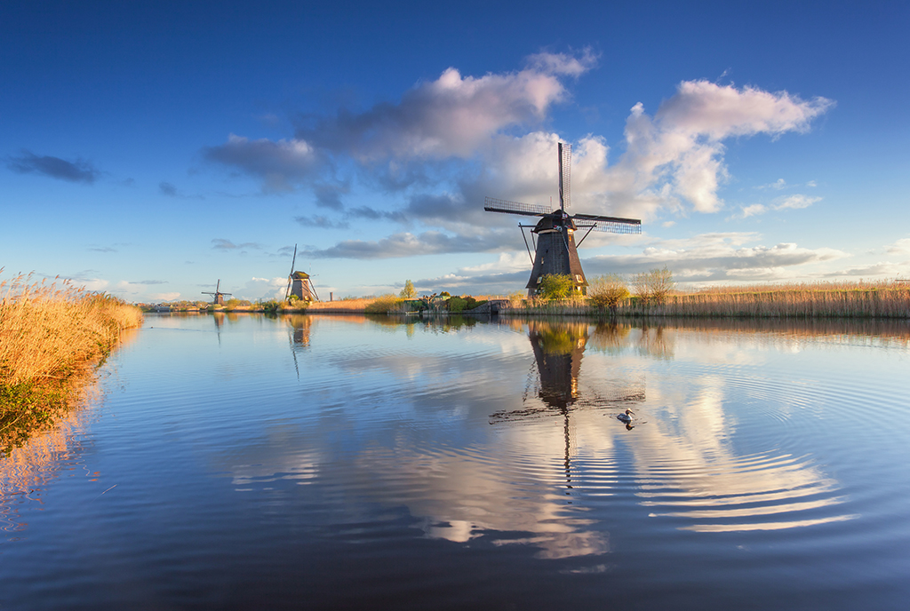 Canal in Holland with windmills