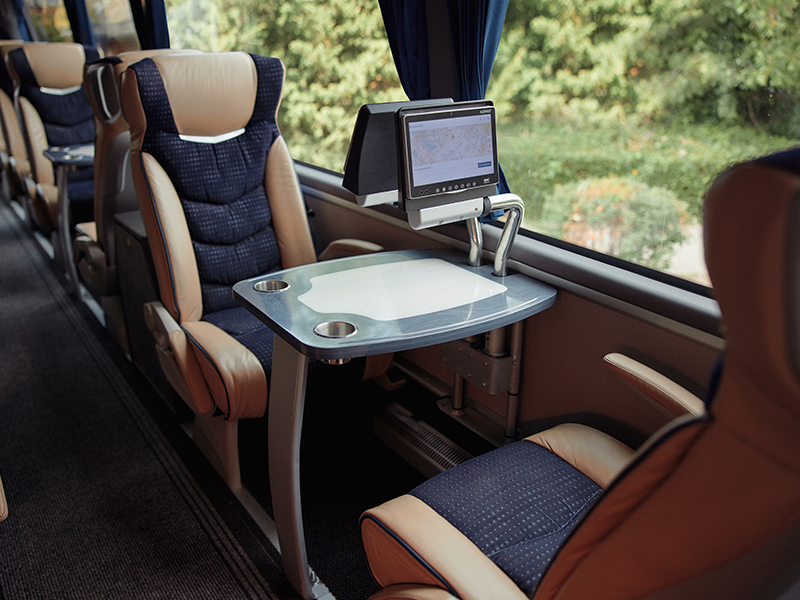 Leger Holidays Luxuria Coach Interior single seating with table and screens
